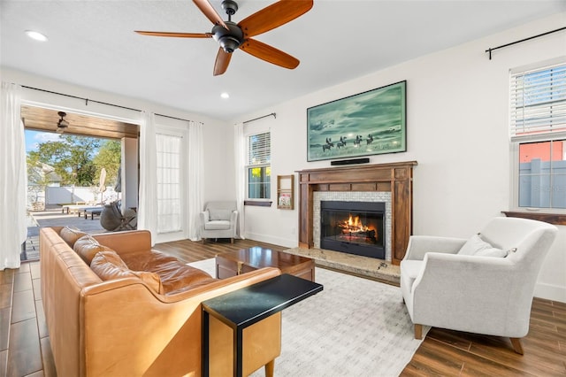 living room with hardwood / wood-style floors and ceiling fan