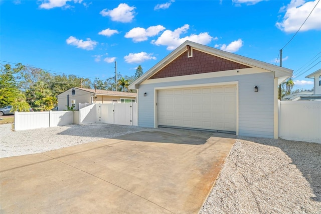 view of front of home featuring a garage and an outdoor structure