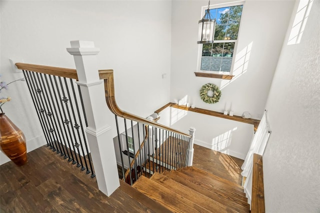 stairs with wood-type flooring