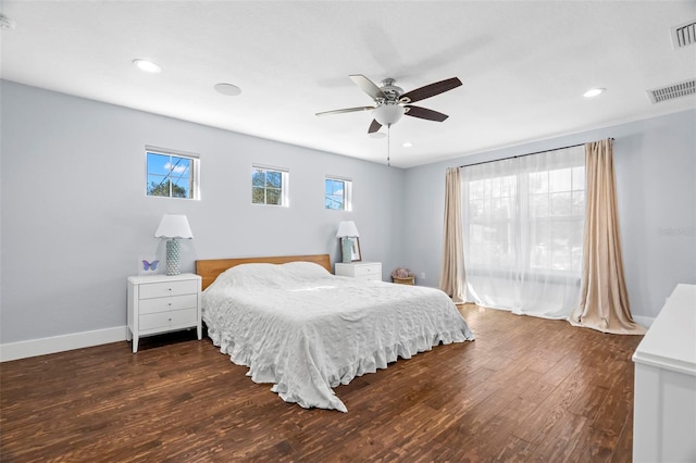 bedroom with ceiling fan and dark hardwood / wood-style flooring