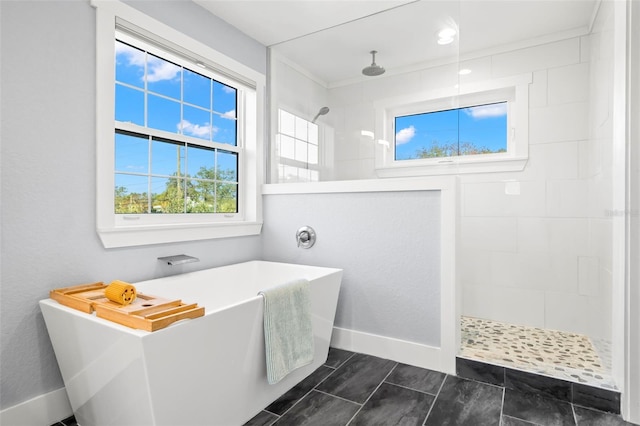 bathroom featuring independent shower and bath