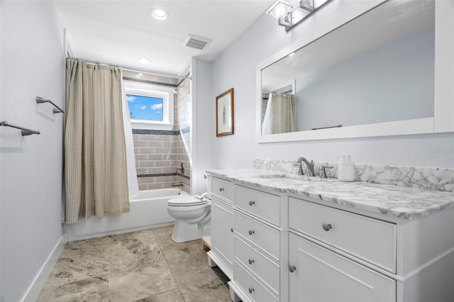 full bathroom with shower / tub combo with curtain, vanity, and toilet