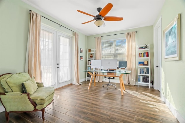 office with dark hardwood / wood-style floors, ceiling fan, and french doors