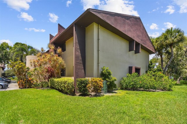 880 S Village Lake Dr N Unit 106, Saint Petersburg, FL 33716 - view of property exterior featuring a yard