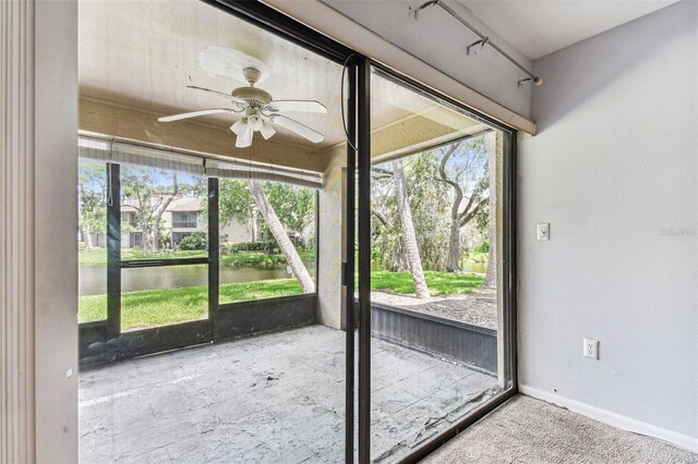 880 S Village Lake Dr N Unit 106, Saint Petersburg, FL 33716 - unfurnished sunroom with a water view and ceiling fan