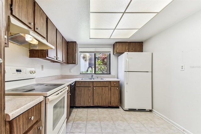 880 S Village Lake Dr N Unit 106, Saint Petersburg, FL 33716 - kitchen with light tile patterned flooring, sink, and white appliances