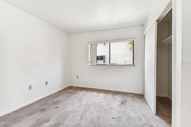 880 S Village Lake Dr N Unit 106, Saint Petersburg, FL 33716 - unfurnished bedroom with light carpet and a closet