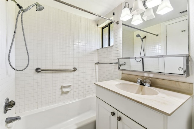 880 S Village Lake Dr N Unit 106, Saint Petersburg, FL 33716 - bathroom featuring tiled shower / bath combo and vanity