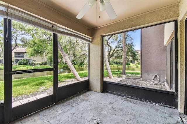880 S Village Lake Dr N Unit 106, Saint Petersburg, FL 33716 - unfurnished sunroom with ceiling fan and a water view