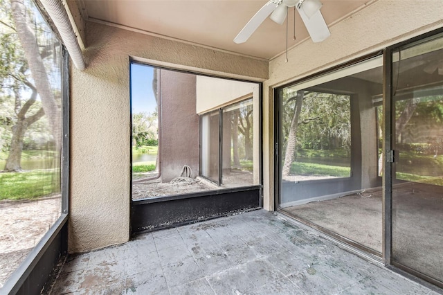 880 S Village Lake Dr N Unit 106, Saint Petersburg, FL 33716 - unfurnished sunroom with ceiling fan