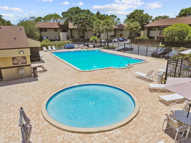 880 S Village Lake Dr N Unit 106, Saint Petersburg, FL 33716 - view of swimming pool featuring a patio area