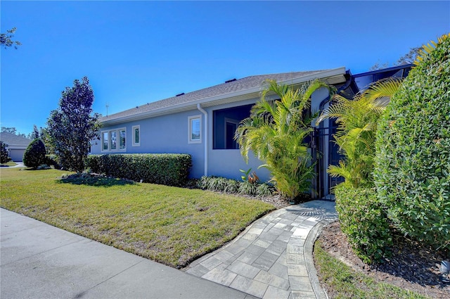 view of home's exterior featuring a lawn