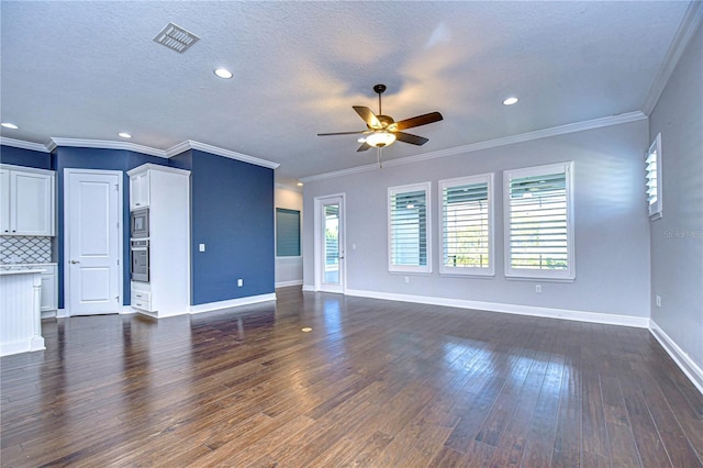 unfurnished living room with ornamental molding, dark hardwood / wood-style floors, a textured ceiling, and ceiling fan