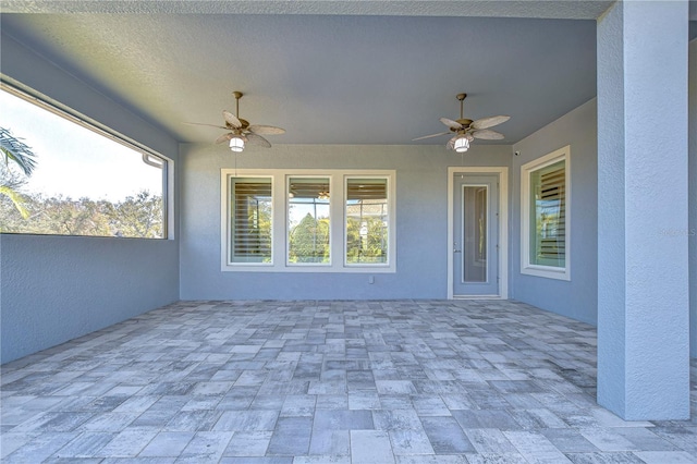 view of patio featuring ceiling fan