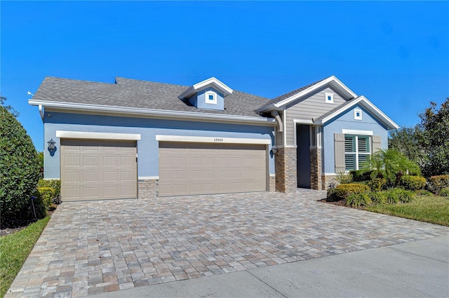 view of front of property with a garage