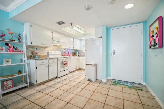 kitchen with white cabinetry, white appliances, tasteful backsplash, and light tile patterned flooring