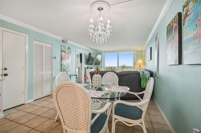 dining room featuring ornamental molding, light tile patterned floors, a notable chandelier, and a textured ceiling