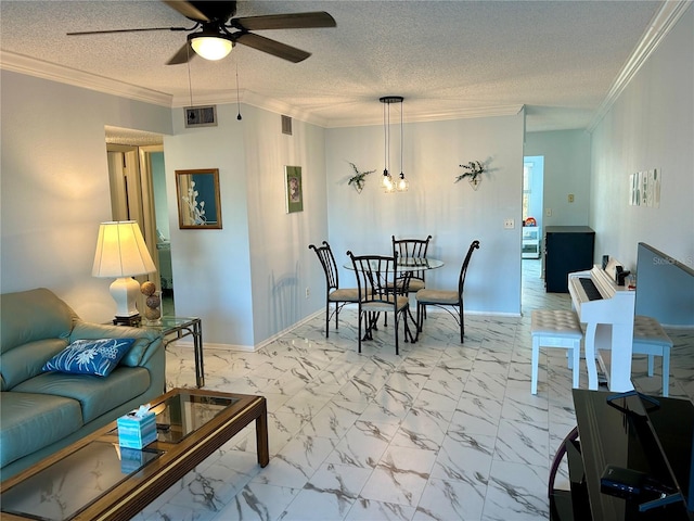 living room featuring crown molding, ceiling fan with notable chandelier, and a textured ceiling