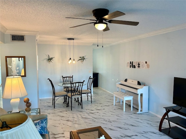 dining space with ceiling fan, crown molding, and a textured ceiling