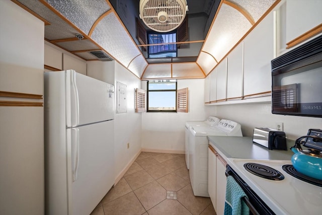 laundry area featuring light tile patterned floors