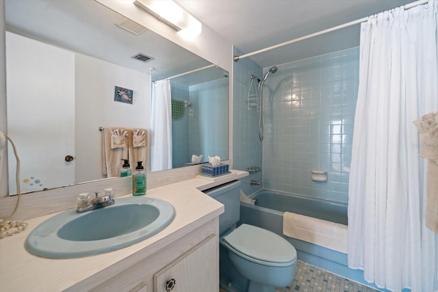 full bathroom featuring vanity, shower / tub combo, and toilet