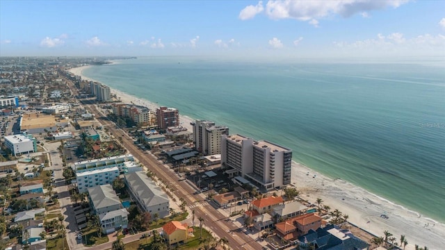 drone / aerial view with a beach view and a water view