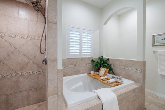 bathroom with shower with separate bathtub