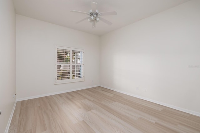 unfurnished room with ceiling fan and light wood-type flooring