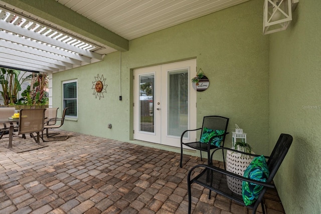 view of patio / terrace with a pergola and french doors