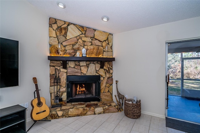 details featuring a textured ceiling and a fireplace