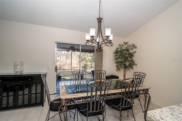 dining room with light tile patterned flooring, lofted ceiling, a chandelier, and a textured ceiling