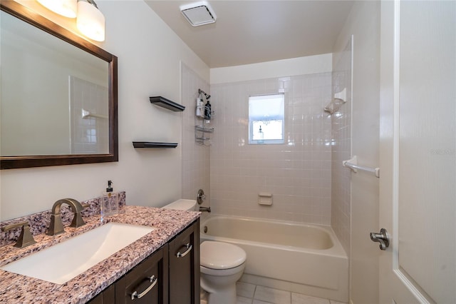 full bathroom with vanity, toilet, tiled shower / bath combo, and tile patterned flooring