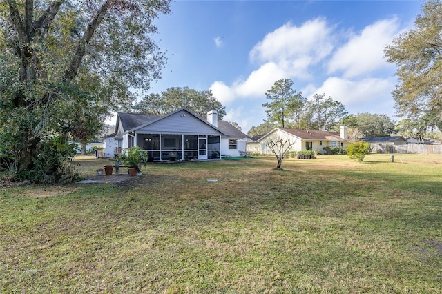 view of yard with a sunroom