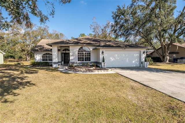 single story home featuring a garage and a front yard