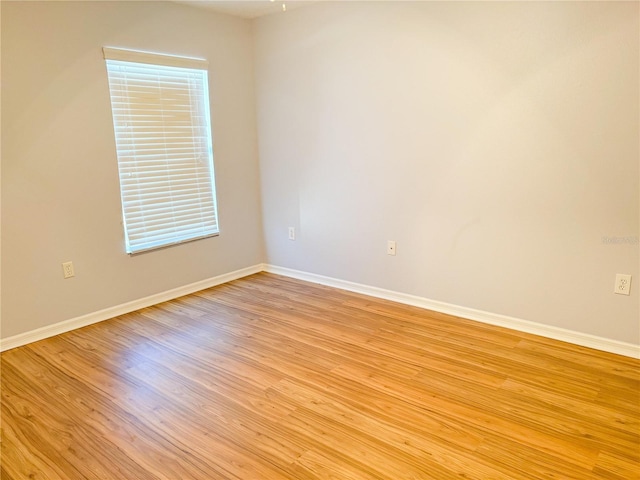 spare room with light wood-type flooring