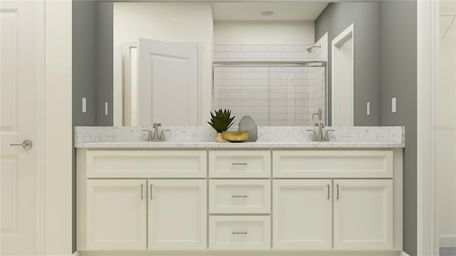 bathroom with vanity and an enclosed shower