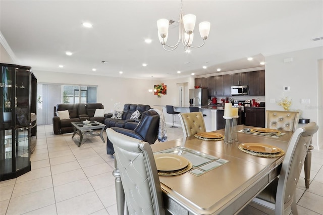 tiled dining area featuring a chandelier