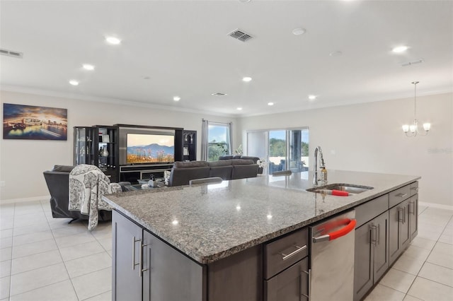 kitchen with sink, crown molding, light stone counters, an island with sink, and stainless steel dishwasher