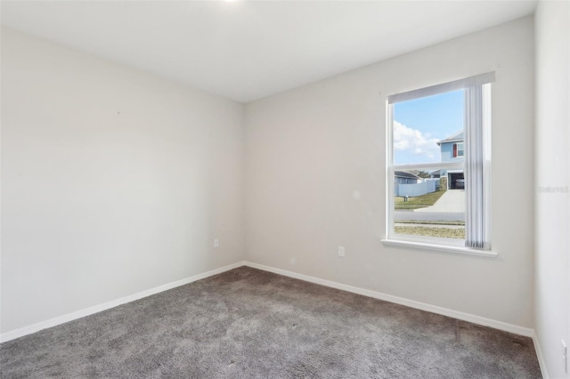 empty room featuring carpet flooring