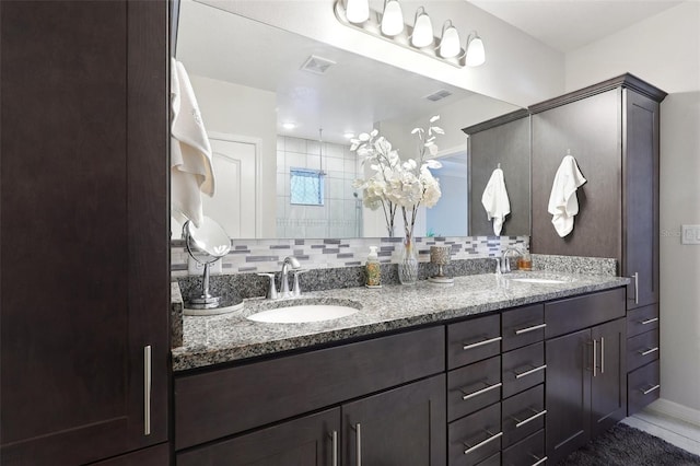 bathroom with vanity and backsplash