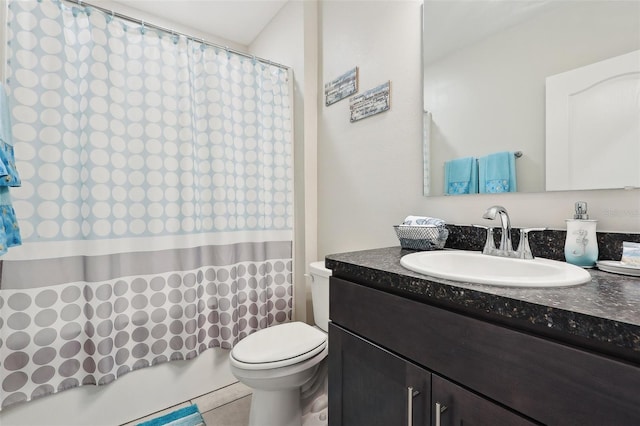 full bathroom featuring tile patterned floors, vanity, toilet, and shower / bath combo with shower curtain