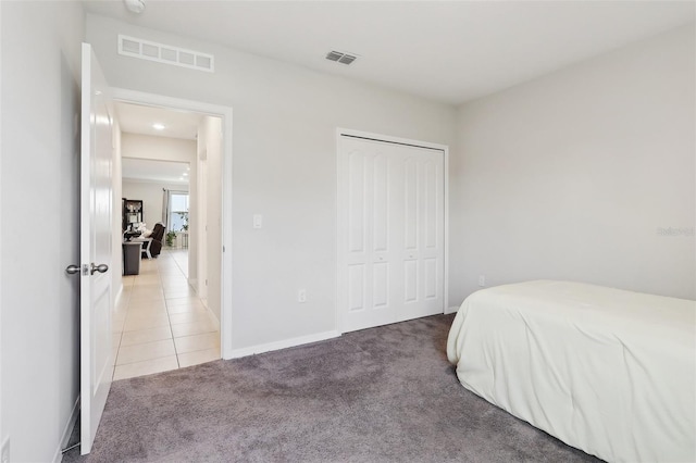 carpeted bedroom with a closet