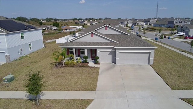 view of front facade featuring a garage, covered porch, and a front yard