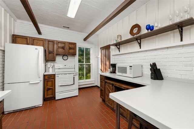 kitchen with beamed ceiling, tasteful backsplash, brick wall, and white appliances
