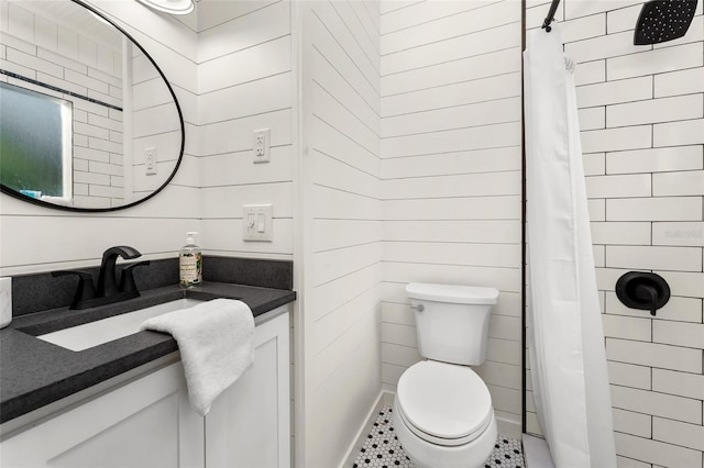 bathroom featuring walk in shower, tile patterned floors, vanity, and toilet
