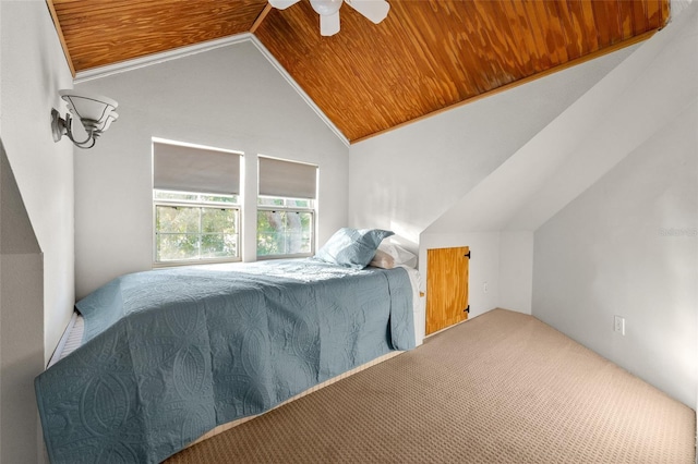 bedroom featuring vaulted ceiling, carpet, ceiling fan, and wood ceiling