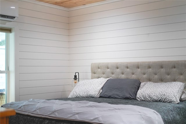 bedroom featuring a wall mounted air conditioner and wooden ceiling