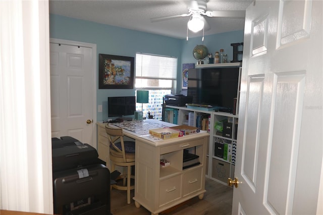 office featuring dark wood-type flooring and ceiling fan