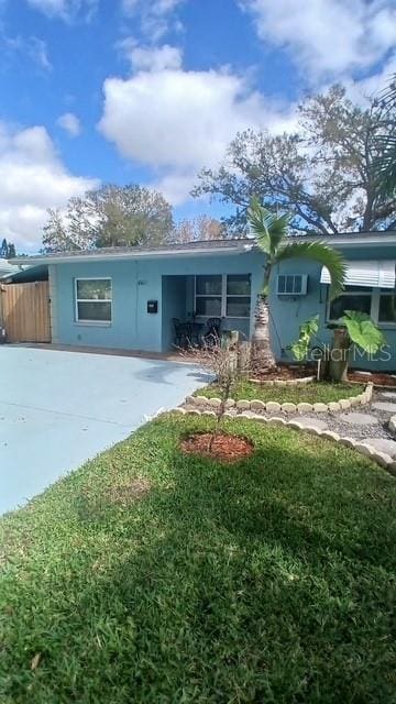 single story home with a front yard and stucco siding