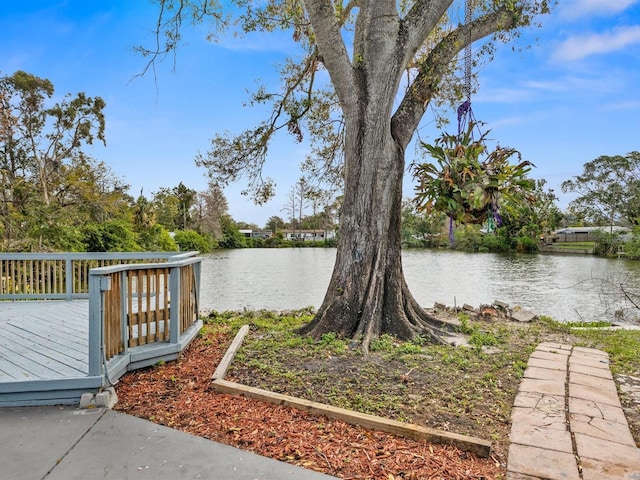 exterior space with a deck with water view